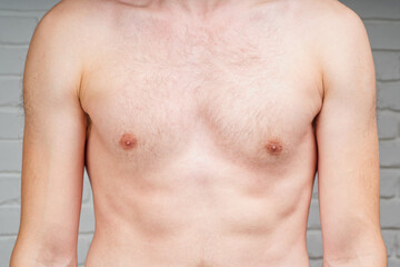 Naklejka premium torso of a young man. body of unrecognizable young caucasian man. Handsome young man's torso