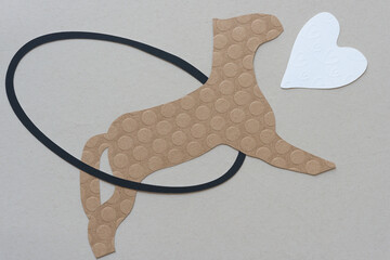 stylized pony leaping through a black paper oval ring at a white heart shape