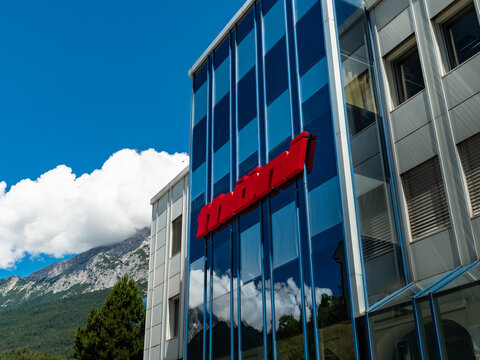 TELFS, AUSTRIA - 25. June 2022: Thöni logo on the building exterior of the headquarters in Tirol. The family-owned company produces aluminium products and automotive components and is a big employer.