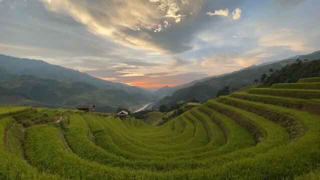 Beautiful scenery of rice terrace fields as U-shape at Mu Cang Chai in northern Vietnam with the movement of clouds on sky. Vietnam landscapes.