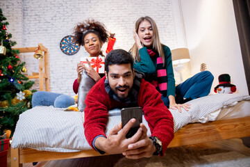 Group young friends taking selfie with excited and enjoy with smart phone together at home, man and...