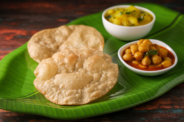 Puri Bhaji North Indian Poori with aalu bhaji , aalu sabji potato spicy recipe breakfast food a deep fried bread of whole wheat flour. poori masala in restaurant Kerala, India, Sri Lanka.