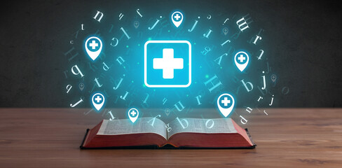 Open medical book with health icons above