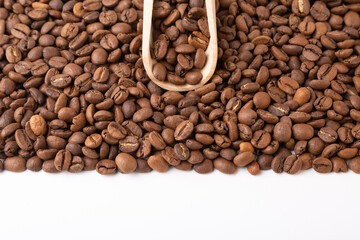 Top view of coffee beans and coffee scoop. Copy space.