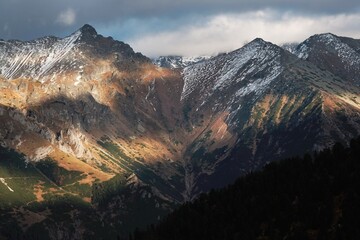 Peaks of the Slovak High Tatras in the evening light, view from blue trail to Sea Eye pond (Morskie Oko), Carpathians, Poland
