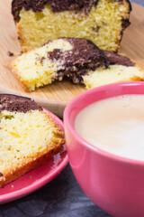 Coffee with milk and fresh baked yeast dough with cocoa for different festive occasions. Delicious dessert