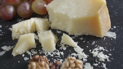 pieces of parmesan or parmigiano cheese and grapes