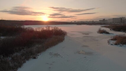 Fototapeta premium Aero video shooting - a frozen lake in the city of Chelyabinsk, Russia. Chelyabinsk city landscape in winter
