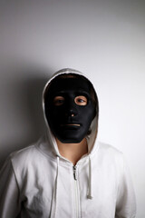 white person with black mask
