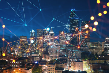 Illuminated aerial cityscape of Seattle, downtown at night time, Washington, USA. Social media hologram. Concept of networking and establishing new people connections