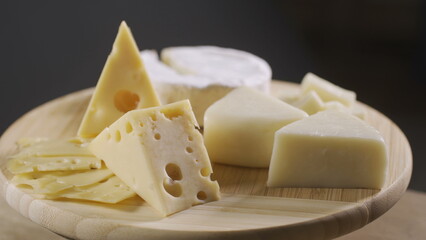 Pieces of different cheeses on plate