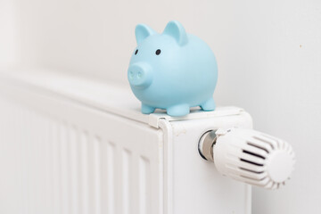 Heating battery with piggy bank on it