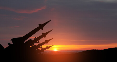 The missiles are aimed to the sky at sunset. Nuclear bomb, chemical weapons, missile defense, a...