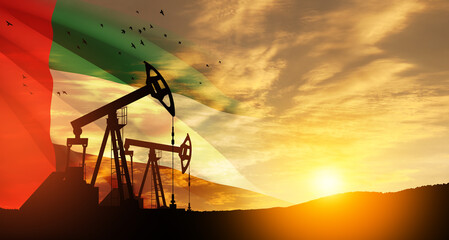 Fototapeta premium The change in oil prices caused by the war. Oil prices are rising because of the global crisis. Oil drilling derricks at desert oilfield with UAE flag. Crude oil production from the ground.