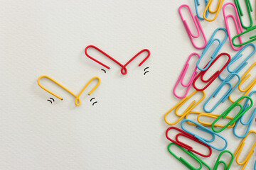 Concept image of unique thinking. Paper clips in the shape of birds. Idea of teamwork and leadership