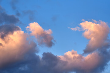 Fototapeta premium Fluffy clouds with colorful light in the evening
