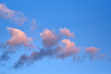 Fluffy clouds with colorful light in the evening
