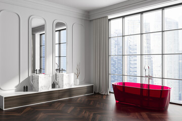 Stylish bathroom interior with double sink and bathtub, panoramic window