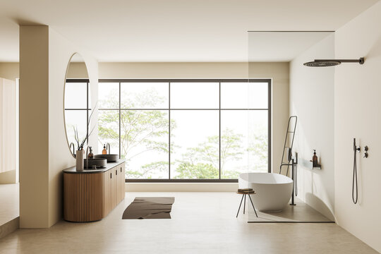 Modern bathroom interior with washbasin and tub with shower, panoramic window