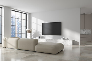Stylish studio interior with soft place and kitchen zone, panoramic window
