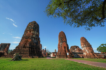 Ruins of pagodas, monks and walls that remain of Wat Mahathat, Ayutthaya, Thailand, which were...