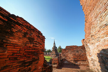 Ruins of pagodas, monks and walls that remain of Wat Mahathat, Ayutthaya, Thailand, which were...