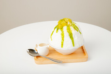 Kiwi Japanese shaved ice. Snow ice with Kiwi toping and milk.