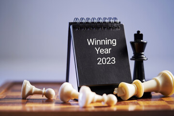 chess pieces and desk calendar 2023