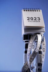 desk calendar 2023 with dumbbell and  tape measure