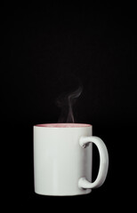 steaming white coffee cup on black background