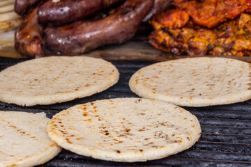 Colombian arepas on a grill, Bogota, Colombia.