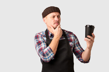 Young man barista portrait on white background with copy space