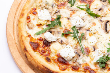 Delicious Italian pizza with champignons, cheese, arugula.