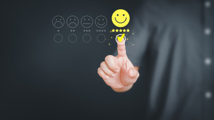 Man touching the virtual screen on the happy smiley face icon to give satisfaction in service. Rating very impressed. Customer service, testimonial and satisfaction concept.