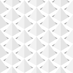 Image of a series of gray pyramids set in squares.