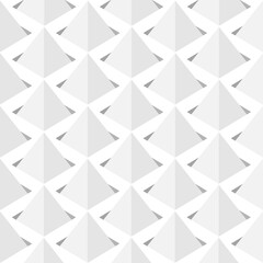 Image of a series of gray pyramids set in squares.