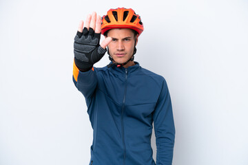 Young cyclist caucasian man isolated on white background making stop gesture