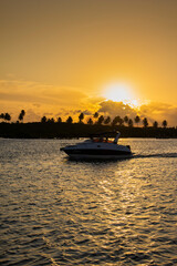 Naklejka premium People have fun at brazilian sunrise beach on October, 2022, Porto de Galinhas, Brazil.