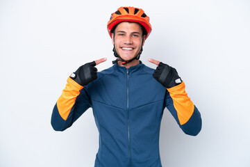 Young cyclist caucasian man isolated on white background giving a thumbs up gesture