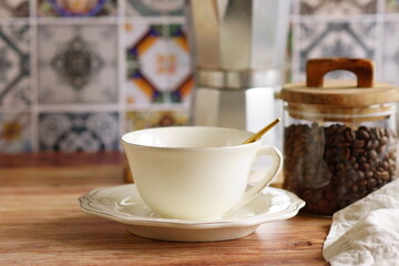 Coffee cup mockup and kitchen utensils table Portuguese and Spain Azulejo tile background,trendy Eco style home still life. Space for text or menu . Business food brand template. 