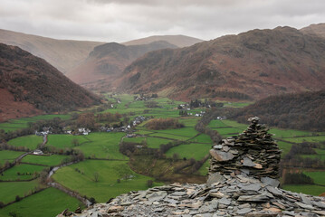 Beautiful vibrant Autumn landscape image towards Borrowdale Valley from Castle Crag in Lake Disrtrict