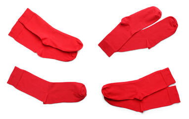 Set with pairs of red socks on white background, top view