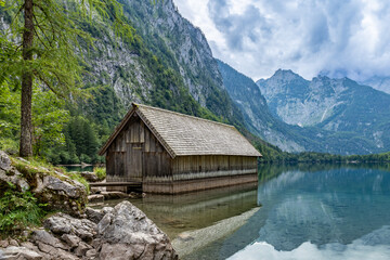 Fototapeta na wymiar Boat House at Obersee Mountain Lake in Alps, Berchtesgaden, Germany, Europe