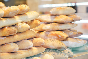 Stacked loaves of bread displayed for sale to the public
