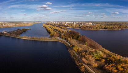Fototapeta na wymiar Panoramic aerial view of city on Volga with dam of water power house in foreground, Dubna, Russia