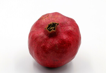 Red pomegranate fruit on a white background