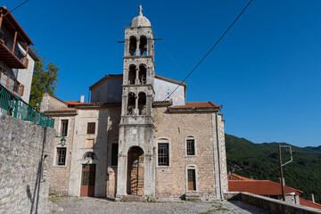 Fototapeta na wymiar Taxiarchon church and bell tower in Dimitsana village, Arcadia, Greece