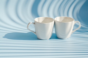 Cups of hot black coffee, tea on blue background. Top view, copy space, mockup. Flat lay. Modern breakfast food.