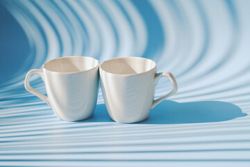 Cups of hot black coffee, tea on blue background. Top view, copy space, mockup. Flat lay. Modern breakfast food.