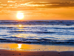 wide sandy sea beach at the sunset, natural summer sea vacation scene